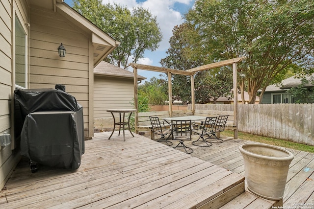 wooden terrace featuring grilling area