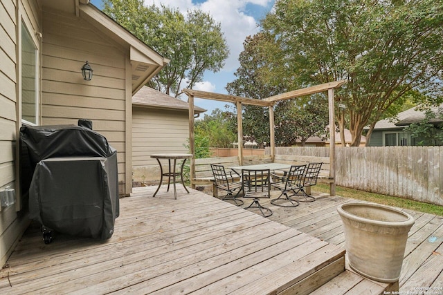 wooden deck with fence and outdoor dining space