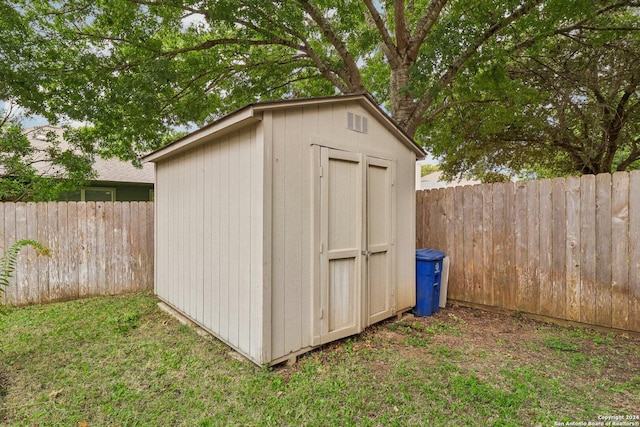view of shed featuring a fenced backyard