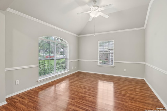 unfurnished room with a wealth of natural light, vaulted ceiling, wood-type flooring, and ceiling fan