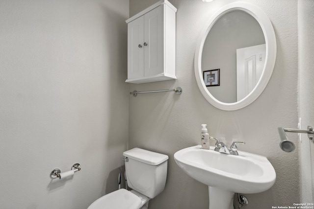 bathroom with sink and toilet