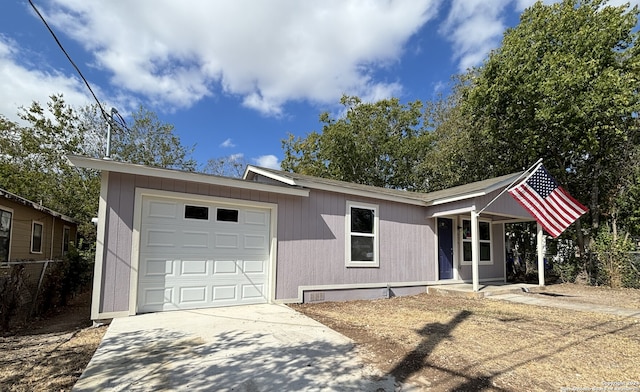 ranch-style house featuring a garage