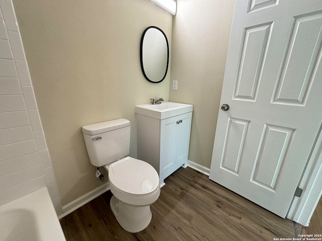 full bathroom featuring vanity, toilet, independent shower and bath, and hardwood / wood-style floors