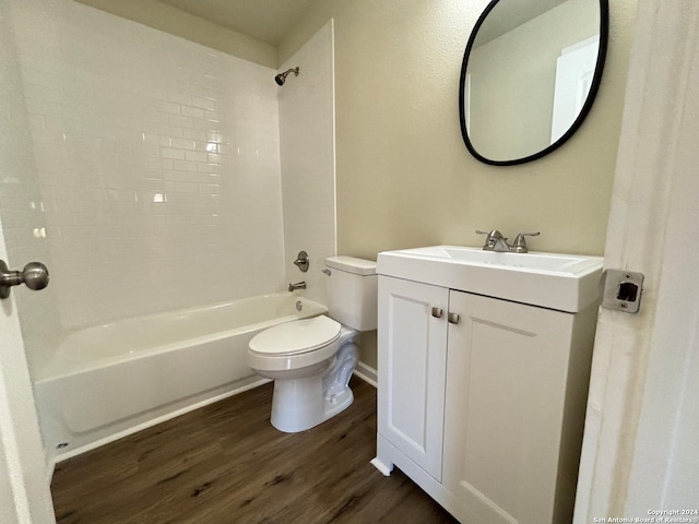 full bathroom with vanity, toilet, hardwood / wood-style flooring, and tiled shower / bath combo