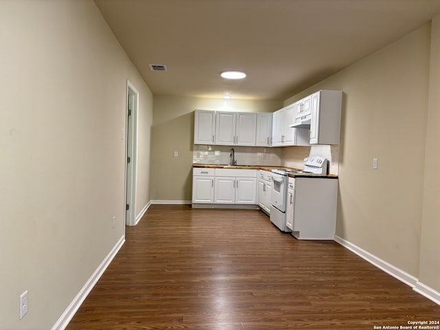 kitchen with decorative backsplash, white cabinetry, dark hardwood / wood-style floors, white electric stove, and sink