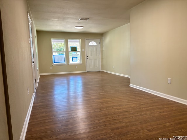 entrance foyer featuring dark hardwood / wood-style floors