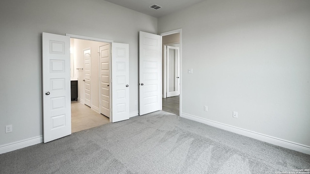 unfurnished bedroom with light carpet