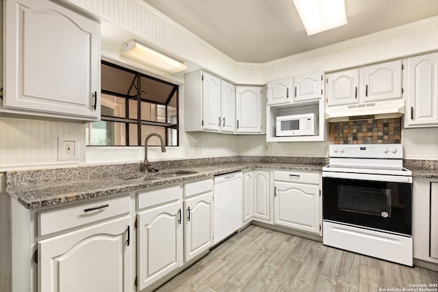 kitchen featuring white appliances, sink, light hardwood / wood-style floors, white cabinets, and crown molding