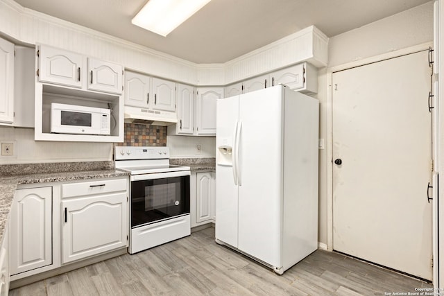 kitchen featuring white appliances, white cabinetry, light hardwood / wood-style flooring, and decorative backsplash