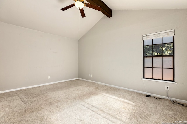 carpeted empty room featuring lofted ceiling with beams and ceiling fan