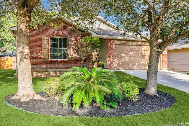 view of front facade with a garage and a front lawn