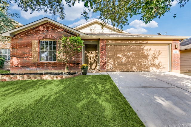 ranch-style home with a garage and a front yard