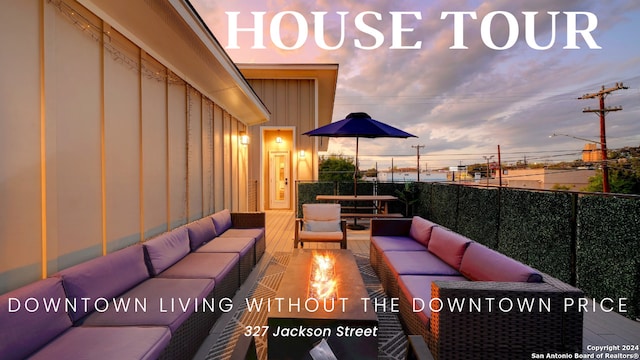 patio terrace at dusk featuring an outdoor hangout area