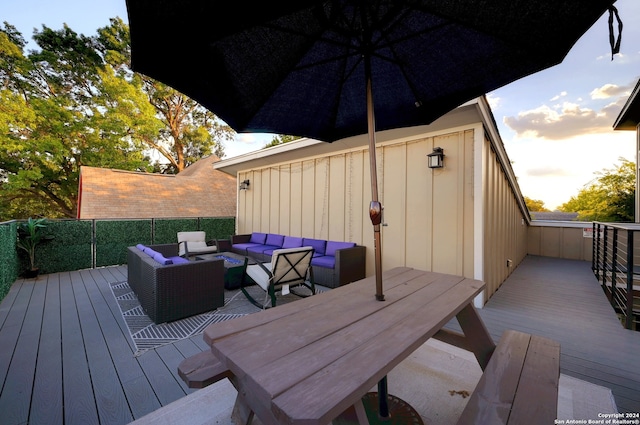 wooden terrace featuring outdoor lounge area