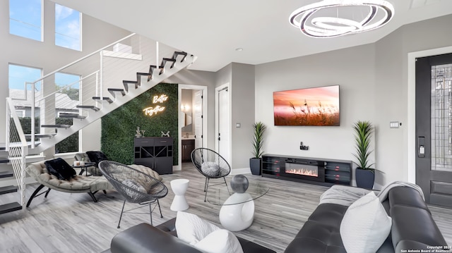 living room featuring a wealth of natural light and light hardwood / wood-style flooring