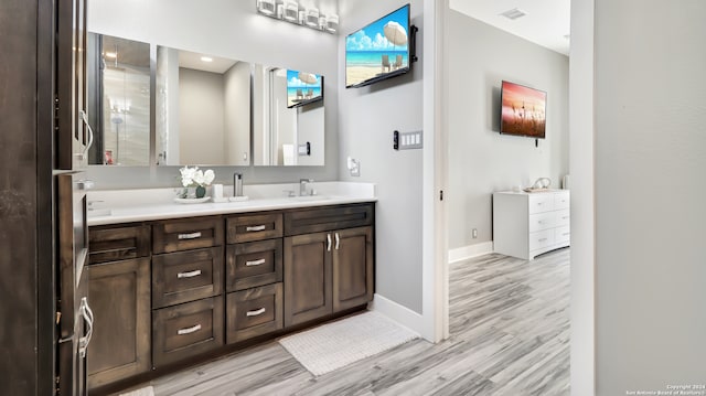 bathroom with vanity and hardwood / wood-style floors