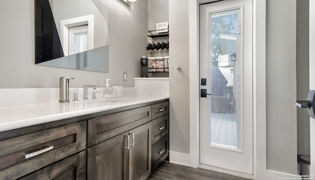 bathroom featuring vanity and hardwood / wood-style flooring