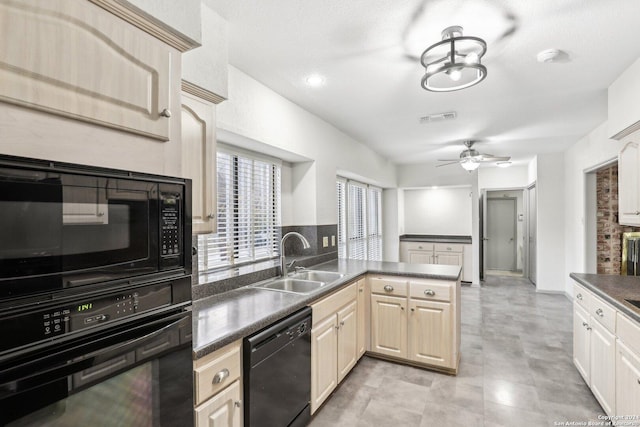 kitchen featuring ceiling fan, sink, kitchen peninsula, a textured ceiling, and black appliances