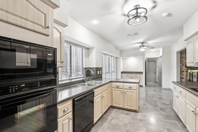 kitchen with kitchen peninsula, ceiling fan, sink, and black appliances