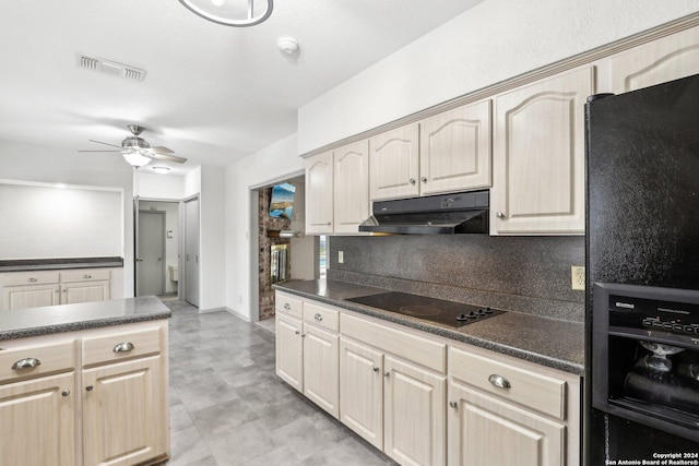 kitchen with black appliances, ceiling fan, and tasteful backsplash