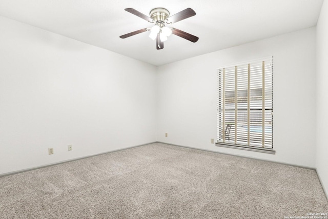 carpeted empty room with ceiling fan