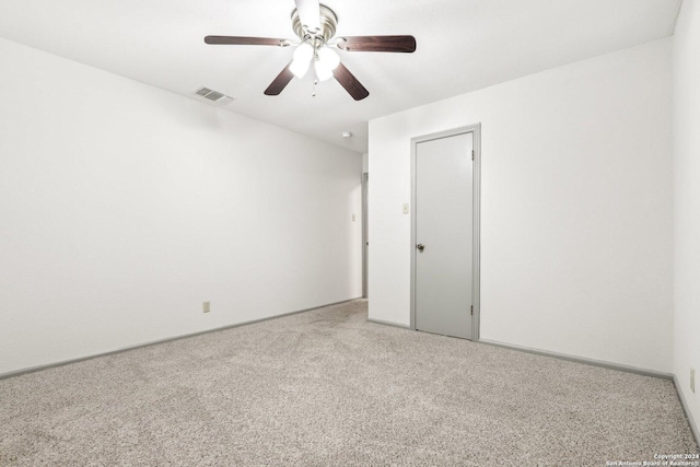 spare room with carpet flooring and ceiling fan