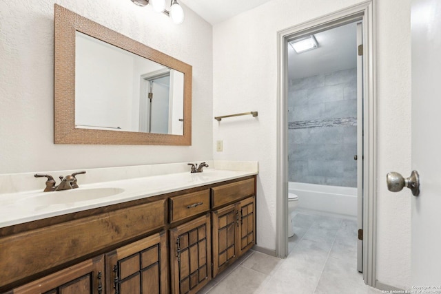 full bathroom featuring tile patterned floors, vanity, toilet, and tiled shower / bath