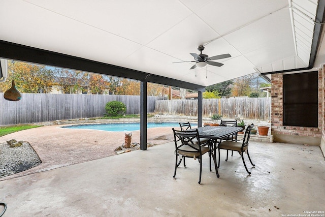 view of patio with a fenced in pool