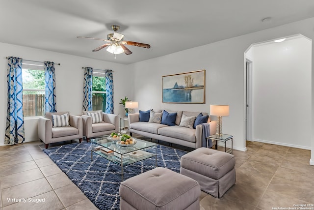 living room with light tile patterned flooring and ceiling fan