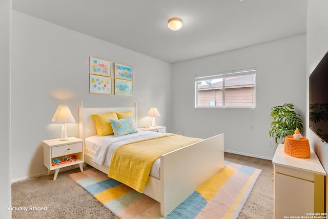 bedroom with light carpet