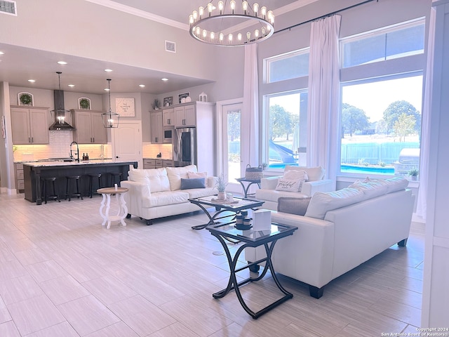 living room featuring a chandelier and a high ceiling