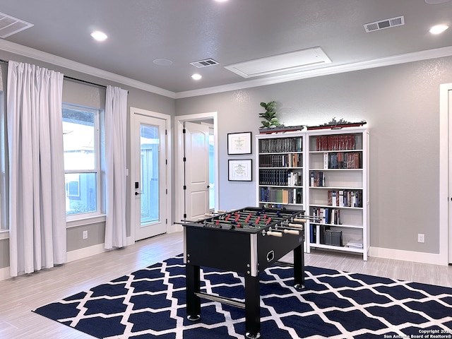 playroom featuring hardwood / wood-style floors and crown molding