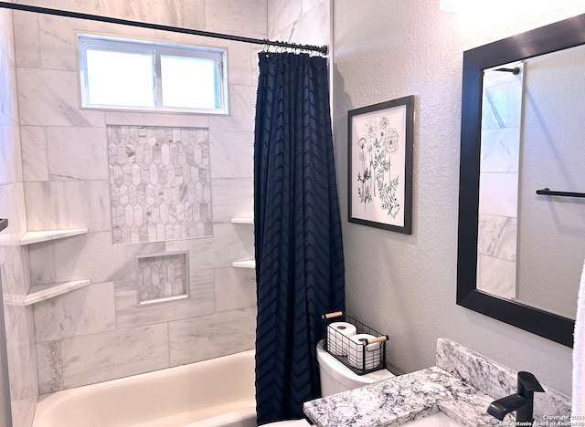 full bathroom featuring vanity, shower / bath combo, and toilet