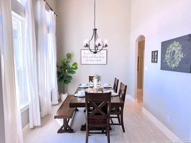 dining area with an inviting chandelier