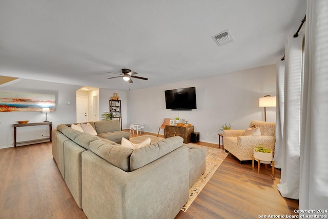 10315 Red Iron Crk, Converse, TX 78109 - living area with wood finished floors, a ceiling fan, and baseboards