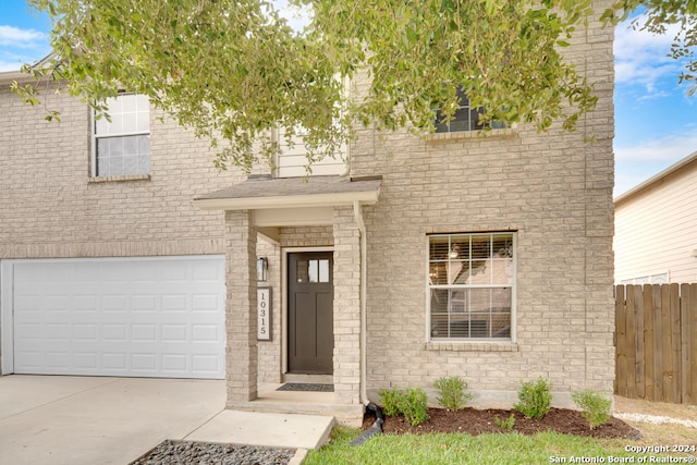 doorway to property featuring a garage