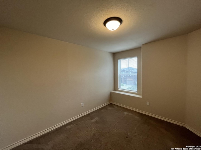 6607 Mia Way, San Antonio, TX 78233 - empty room with baseboards and dark colored carpet
