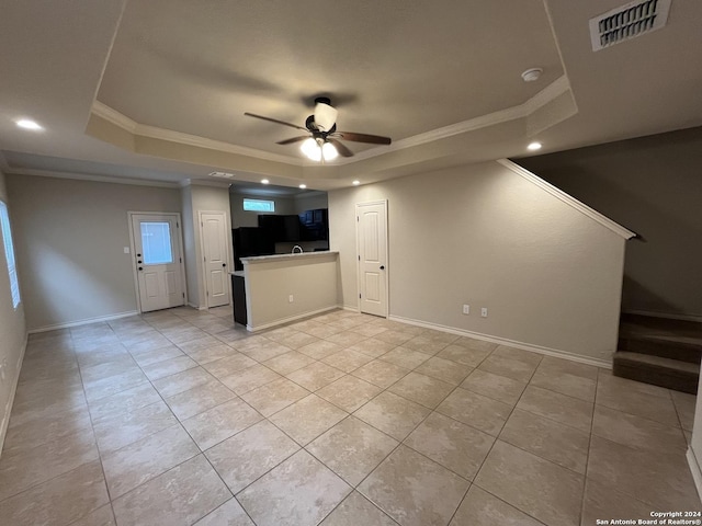 6607 Mia Way, San Antonio, TX 78233 - unfurnished living room with a tray ceiling, a ceiling fan, crown molding, light tile patterned floors, and recessed lighting