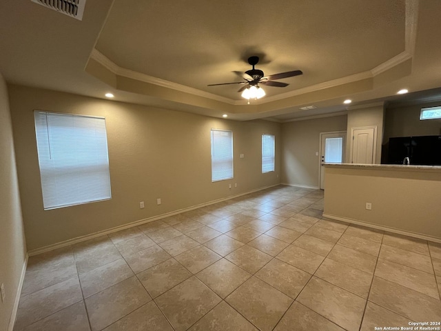 6607 Mia Way, San Antonio, TX 78233 - empty room with a raised ceiling, crown molding, light tile patterned flooring, recessed lighting, and plenty of natural light