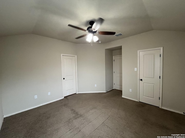 6607 Mia Way, San Antonio, TX 78233 - unfurnished bedroom with lofted ceiling, dark colored carpet, baseboards, and a ceiling fan