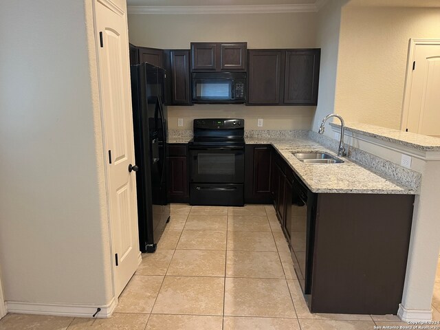 kitchen featuring sink, black appliances, light stone counters, and ornamental molding