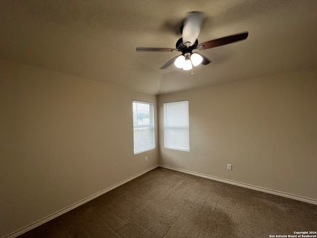 carpeted empty room featuring ceiling fan