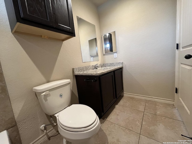 6607 Mia Way, San Antonio, TX 78233 - half bathroom with toilet, vanity, tile patterned floors, and baseboards