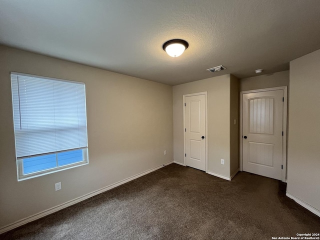 6607 Mia Way, San Antonio, TX 78233 - unfurnished bedroom with dark colored carpet and baseboards