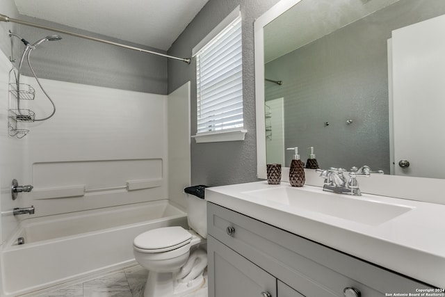 full bathroom featuring vanity, washtub / shower combination, and toilet