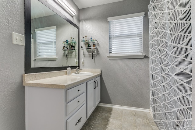 bathroom with vanity and tile patterned floors