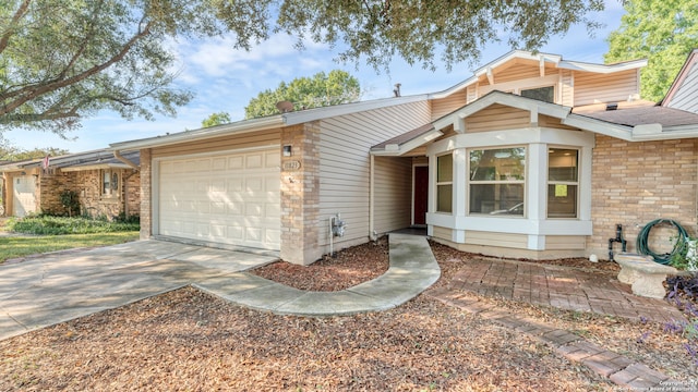 ranch-style home featuring a garage