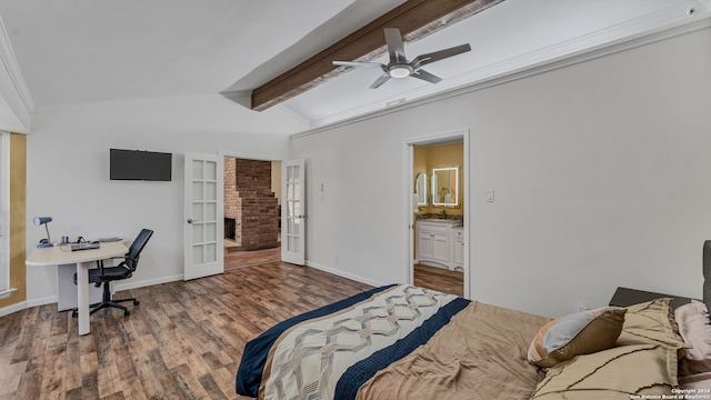 bedroom with wood-type flooring, vaulted ceiling with beams, ceiling fan, connected bathroom, and ornamental molding