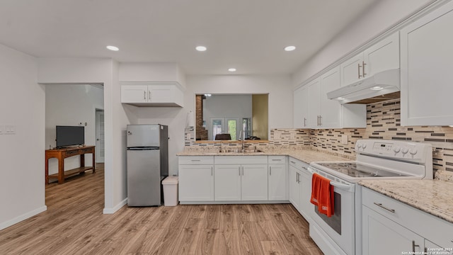 kitchen featuring white range with electric cooktop, light hardwood / wood-style flooring, white cabinetry, and stainless steel refrigerator