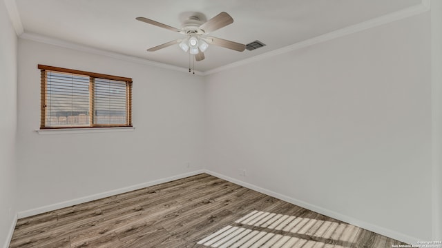 spare room featuring ceiling fan, crown molding, and hardwood / wood-style floors